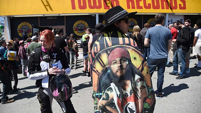 Fans of the rock band Guns N` Roses wait outside the Tower Records building on the Sunset Strip trying to buy a ticket for an impromptu performance tonight at the nearby Troubadour, 1 April, in West Hollywood, California. Photo: AFP