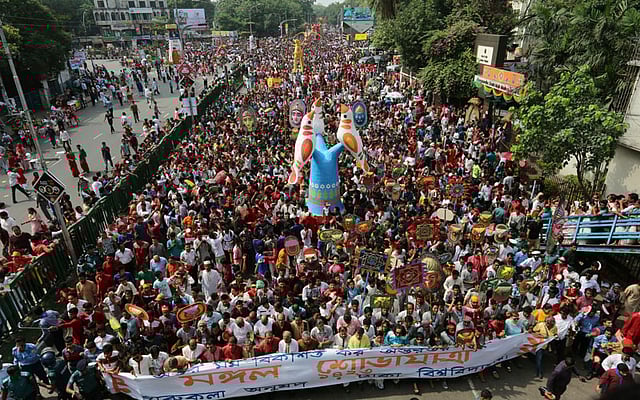 Thousands of people take part in Mangol Shobhajatra festooned with large replicas of bird, fish, animals, and other motifs, on the first day of Bangla year in Dhaka on Thursday. Photo: Zahidul Karim