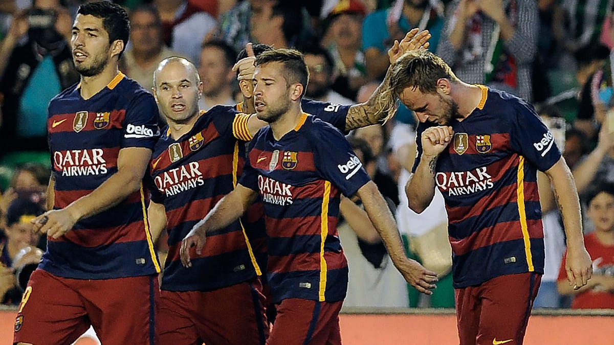 Barcelona`s Uruguayan forward Luis Suarez (L) and Barcelona`s midfielder Andres Iniesta (2nd L) walk with Barcelona`s Croatian midfielder Ivan Rakitic (R) AFP
