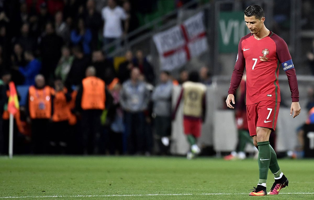 Portugal’s forward Cristiano Ronaldo walks on the pitch during the Euro 2016 group F football match between Portugal and Iceland at the Geoffroy-Guichard stadium in Saint-Etienne. Photo: AFP