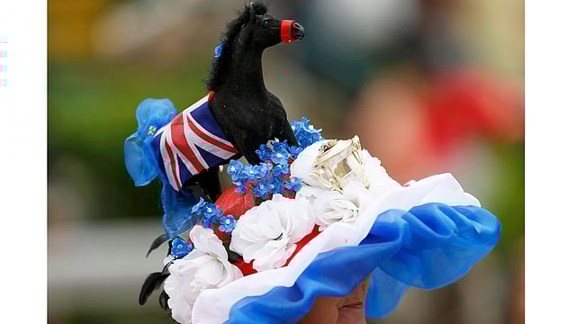 Ladies Day Racegoer wears hat. Photo: Reuters