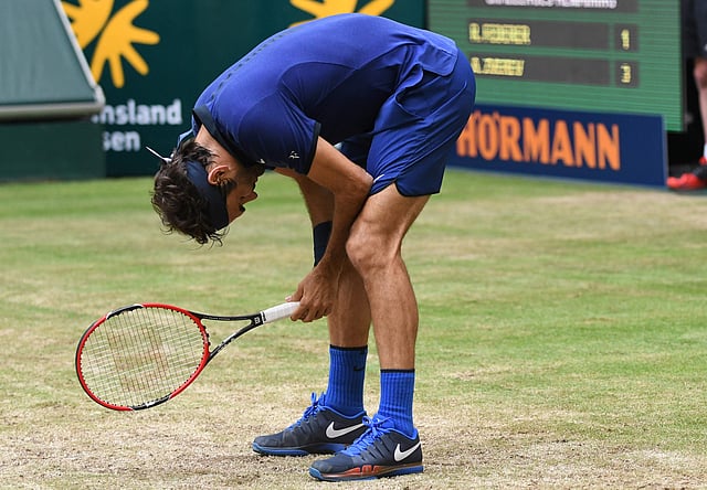 Roger Federer of Switzerland reacts during the ATP tour tennis match against Alexander Zverev of Germany (unseen), in Halle, western Germany, on 18 June, 2016. Photo: AFP