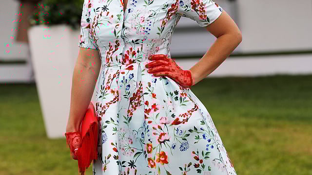 A racegoer poses on Investec Derby ladies day. Photo: Reuters