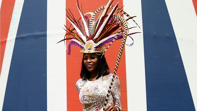 Ladies Day Racegoer wears hat. Photo: Reuters