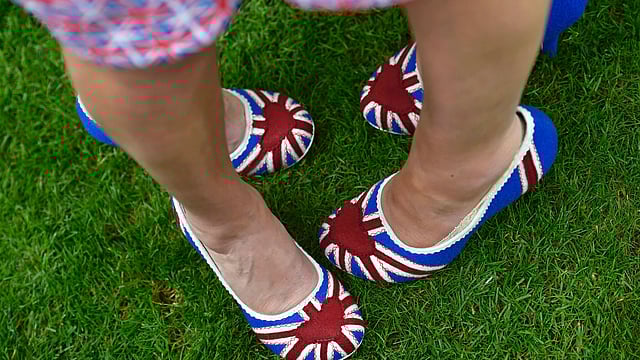 Ladies Day Racegoers wear union flag shoes. Photo: Reuters