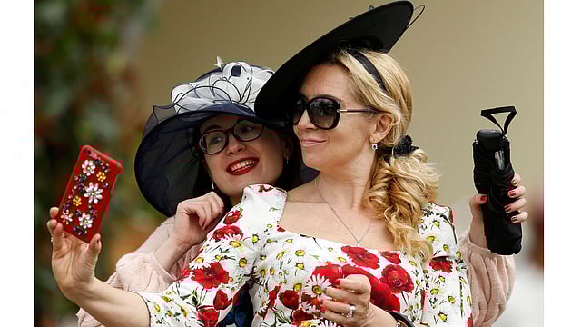Ladies Day Racegoers wear hats. Photo: Reuters