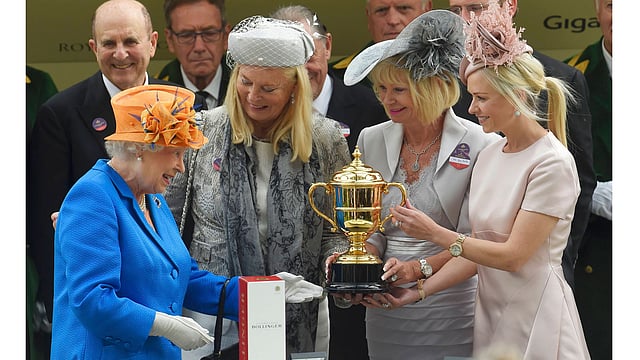 Ladies Day Britain`s Queen Elizabeth presents the Gold Cup to owners of Order Of St George. Photo: Reuters