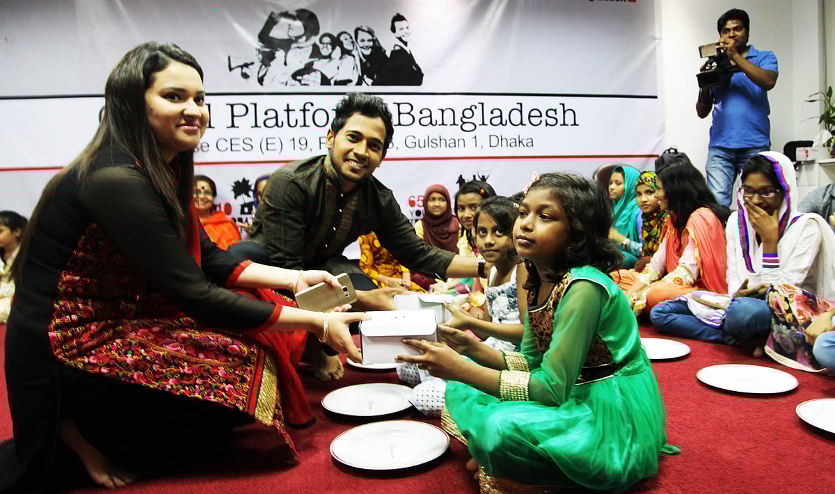 Bangladesh's test cricket captain Mushfiqur Rahim takes part at an iftar with a groups of unprivileged children on 25 June.