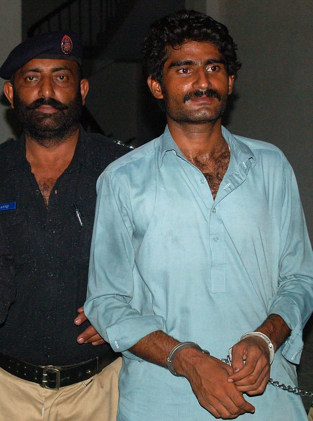 Wasim (R), the brother of slain social media celebrity Qandeel Baloch, is escorted by police following his arrest for Qandeel's death in Multan early on July 17, 2016. Photo: AFP