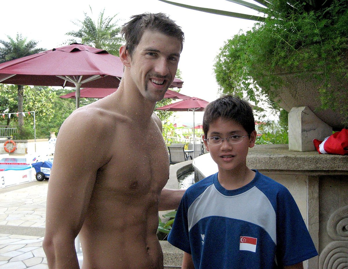 Singapore swimmer Joseph Schooling (R) poses with US swimmer Michael Phelps during a training camp in Singapore in this 2008 photo released by the Schooling family on Saturday. Photo: Reuters