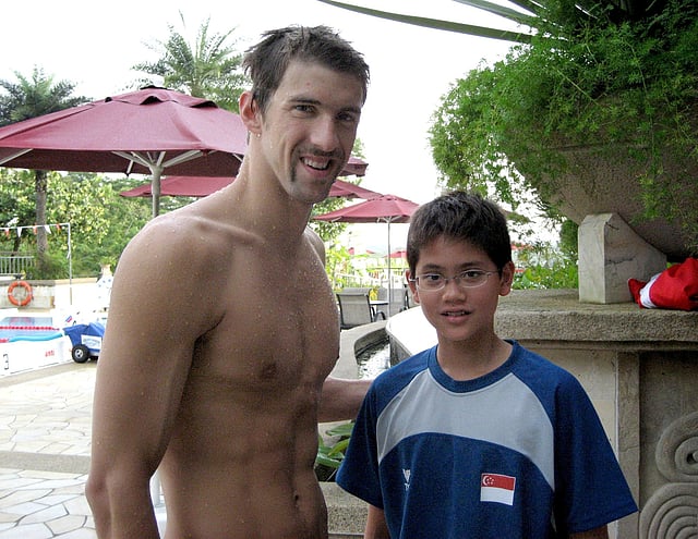 Singapore swimmer Joseph Schooling (R) poses with US swimmer Michael Phelps during a training camp in Singapore in this 2008 photo released by the Schooling family on Saturday. Photo: Reuters