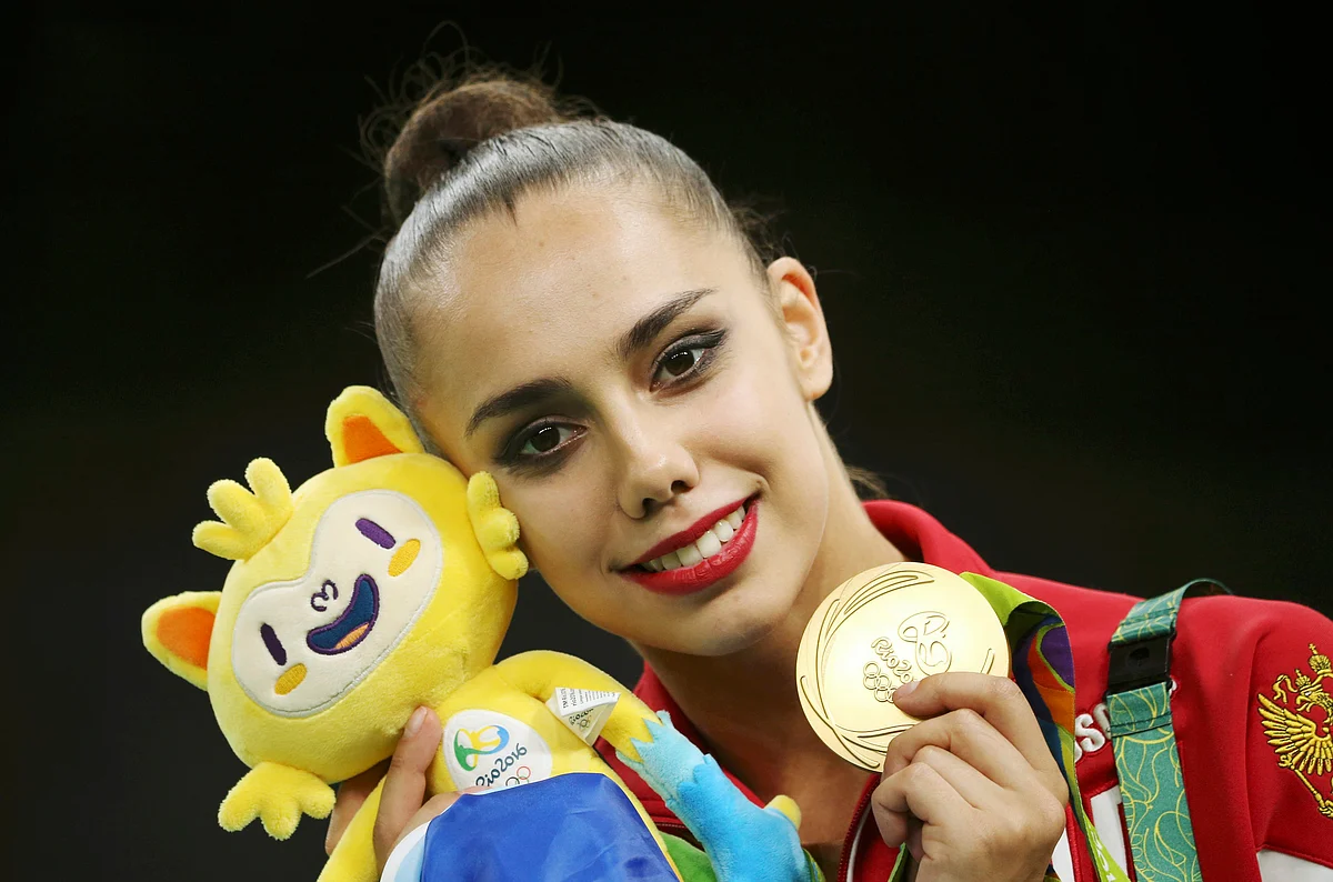 Margarita Mamun (RUS) of Russia poses with her gold medal. REUTERS