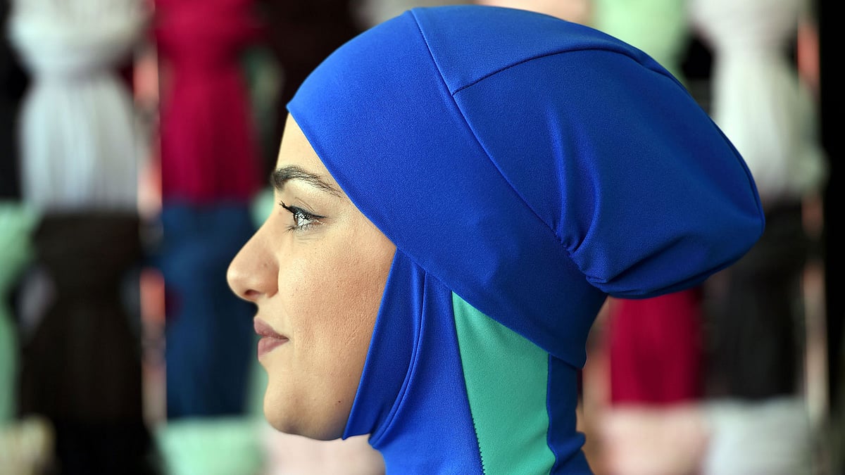 A muslim model display burkini swimsuits at a shop in western Sydney. Photo: AFP