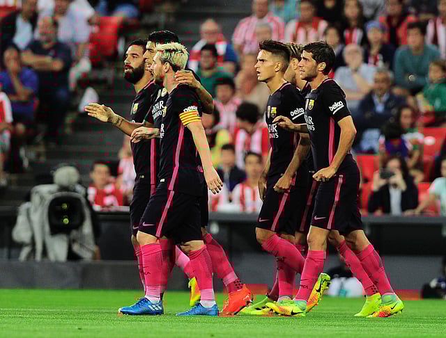 Barcelona's players celebrate after scoring the opener during the Spanish league football match Athletic Club Bilbao vs FC Barcelona at the San Mames stadium in Bilbao. Photo: AFP