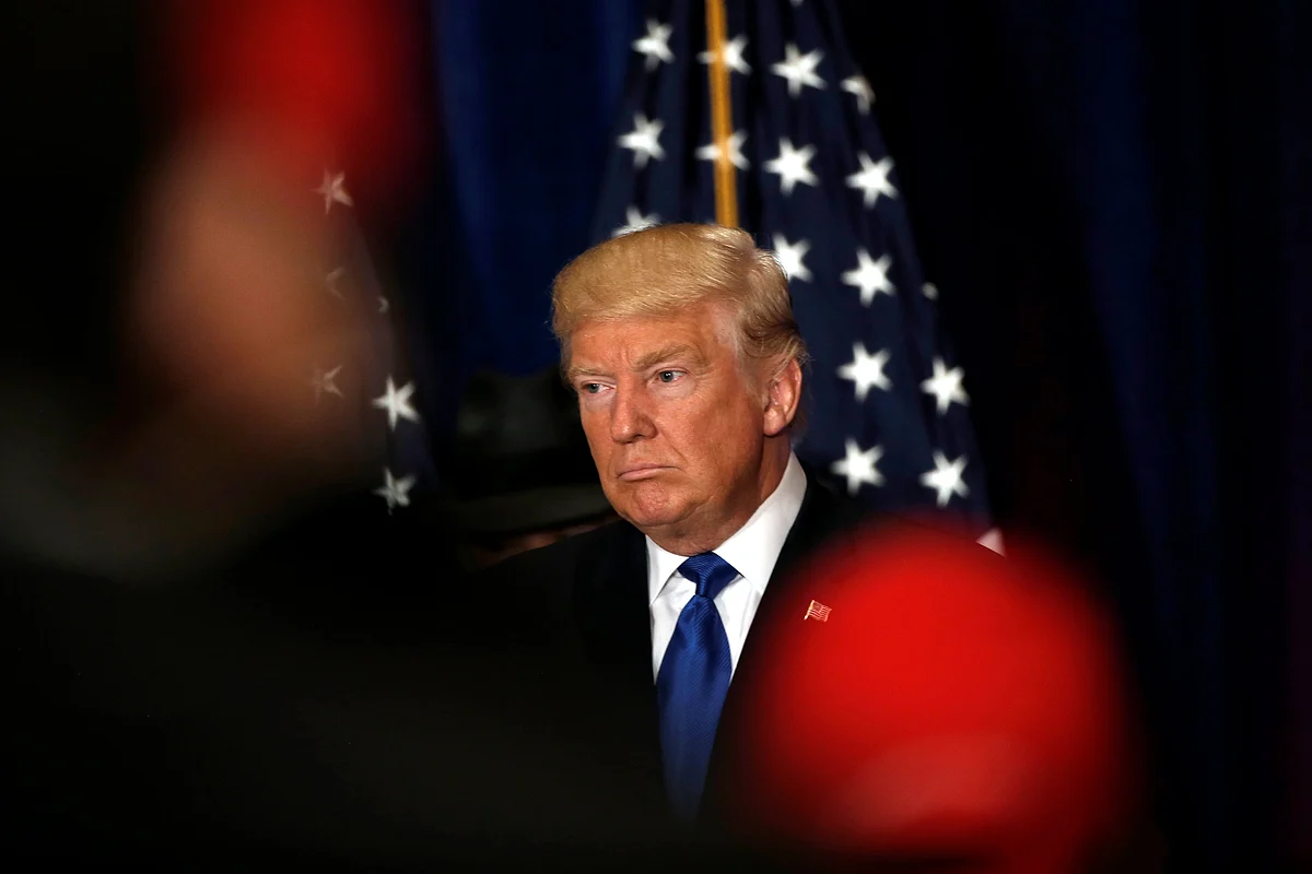 Republican presidential nominee Donald Trumpreacts as reporters yell questions to him after he stated that he believes U.S. President Barack Obama was born in the United States in Washington. Reuters