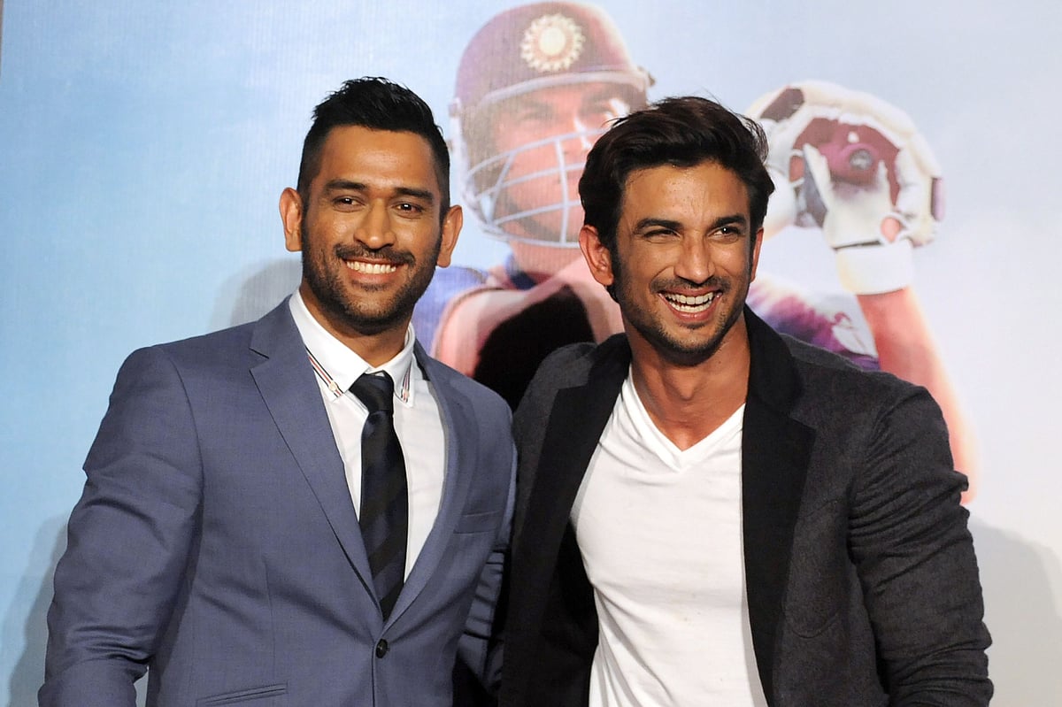In this photograph taken on 11 August, 2016, Indian Bollywood actor Sushant Singh Rajput (R) and Indian cricket captain Mahendra Singh Dhoni pose during the trailer launch in Mumbai of the upcoming biographical film 'MS Dhoni: The Untold Story' directed by Neeraj Pandey. Photo: AFP