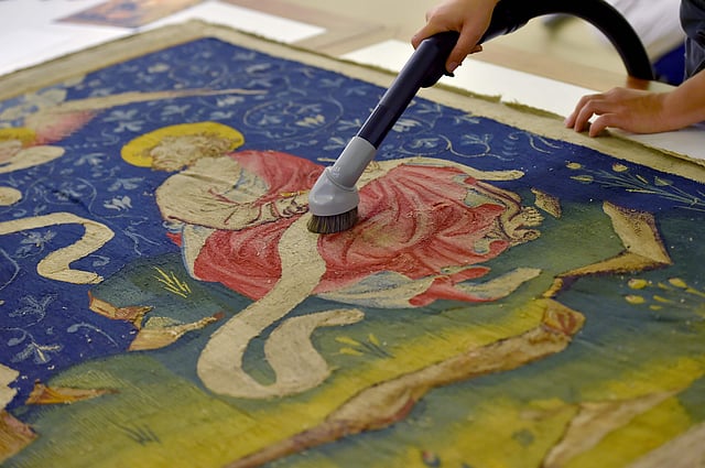 A woman restores a section of the “Apocalypse Tapestry” (1377–1382), the world’s largest and oldest surviving medieval set of tapestries, at the Angers Castle in western France. Photo: AFP