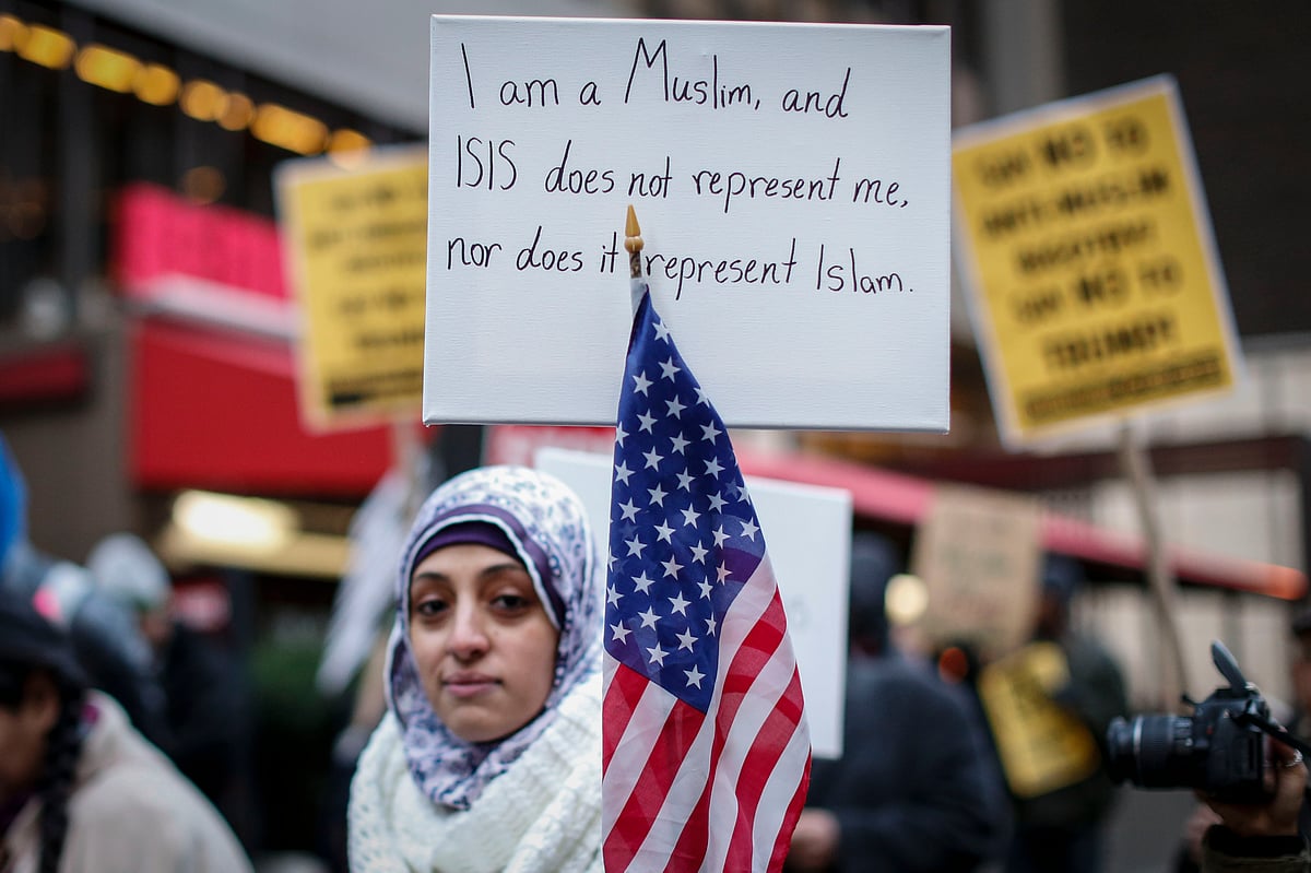 This file photo taken on December 20, 2015 shows a Muslim woman holding a poster during a protest in New York. Photo: AFP