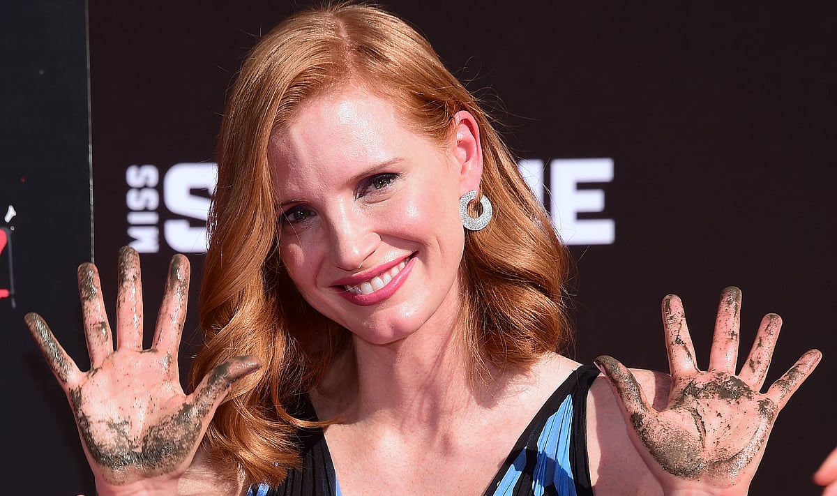 Actress Jessica Chastain displays her hands after imprinting her handprints in the block of cement at her Hand and Footprint Ceremony at the TCL Chinese Theater in Hollywood, California, on 3 November, 2016. Photo: AFP
