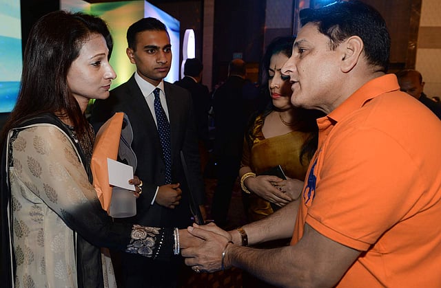 Simeen Hossain (L) and her elder son Zaraif (2ndL) meet members of the audience after she received the Mother Teresa Memorial International Award for Social Justice 2016, on behalf of her son Faraaz Ayaaz Hossain at an award ceremony in Mumbai on November 20, 2016. Photo: AFP