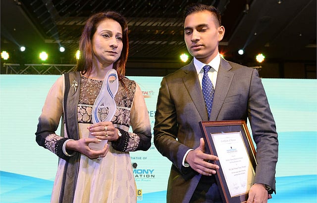 Simeen Hossain (L) and her elder son Zaraif are pictured after she received the Mother Teresa Memorial International Award for Social Justice 2016, on behalf of her son Faraaz Ayaaz Hossain at an award ceremony in Mumbai on November 20, 2016. Photo: AFP