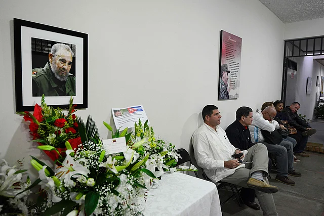 Unidentified persons participate in a vigil in memoriam of Cuban revolutionary leader Fidel Castro at the Cuban embassy in San Jose. Photo: AFP
