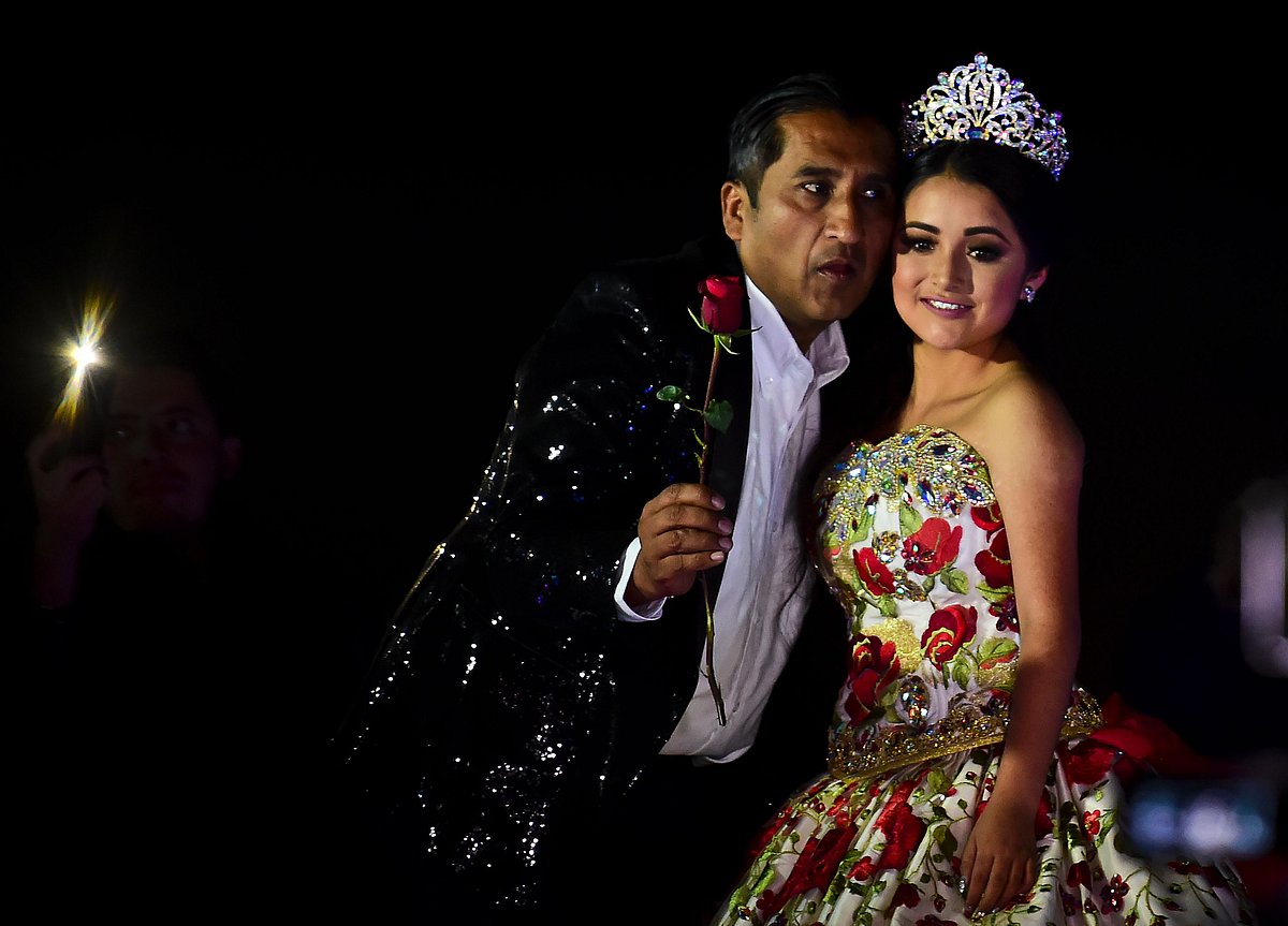 Rubi Ibarra poses during her 15th birthday celebrations in Villa Guadalupe, San Luis Potosi State, on December 26, 2016. Rubi, a small-town Mexican teen, welcomed thousands of guests for her 15th birthday party after her parents' video invitation to the milestone event went viral online.Photo:AFP