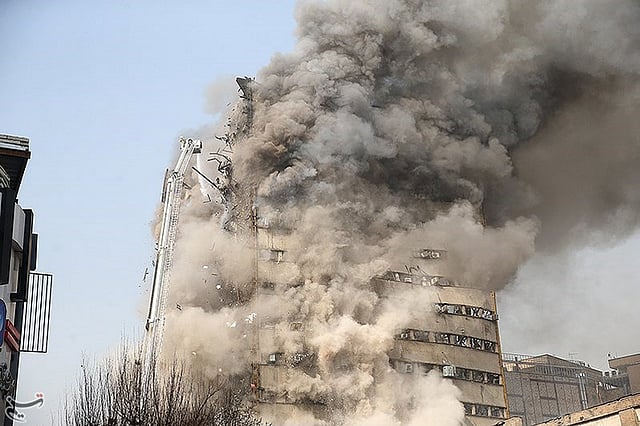 Smoke rises from a blazing high-rise building in Tehran. Photo: Reuters