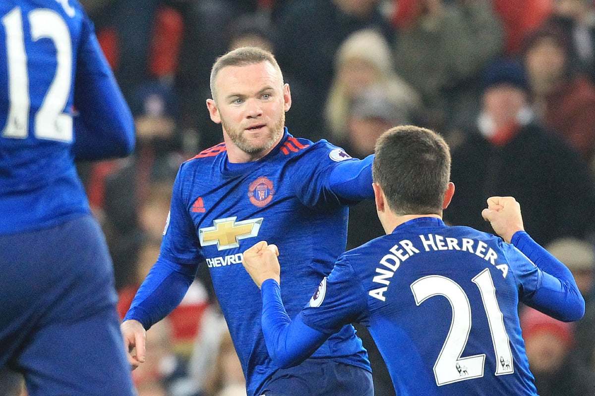 Manchester United’s English striker Wayne Rooney © celebrates scoring the equalising goal for 1-1 and his 250th goal for Manchester United making him the club’s all-time record scorer during the English Premier League football match between Stoke City and Manchester United at the Bet365 Stadium in Stoke-on-Trent, central England. Photo: AFP
