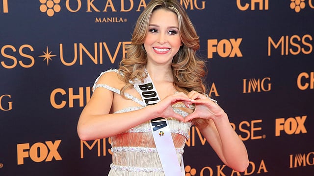 Miss Universe candidate Antonella Moscatelli of Bolivia gesture for a picture during a red carpet inside a SMX convention in metro Manila. Reuters