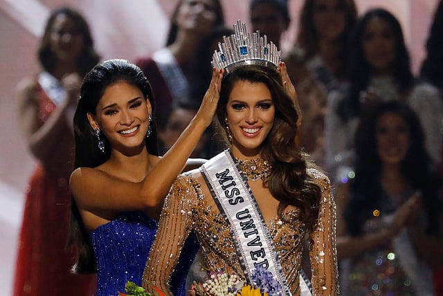 Pia Wurtzbach places the Miss Universe crown on Miss France Iris Mittenaere after the latter was declared winner in the Miss Universe beauty pageant at the Mall of Asia Arena, in Pasay, Metro Manila. Reuters