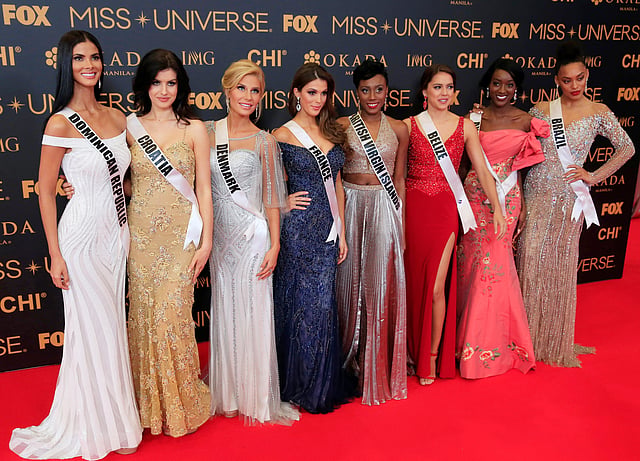 Miss Universe candidates pose for a picture during a red carpet inside a SMX convention in metro Manila. Reuters