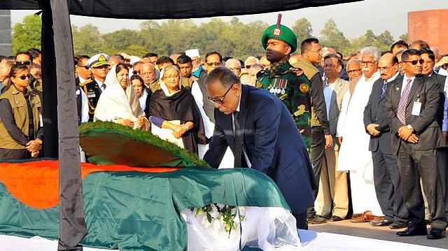 President Abdul Hamid pays tribute to Suranjit Sengupta by placing wreaths on his coffin at South Plaza of Jatiya Sangsad Bhaban. Photo: Saiful Islam