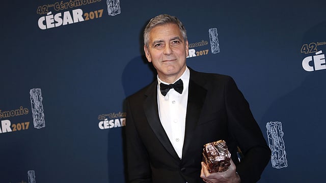US actor George Clooney poses with his honorary award during a photocall during the 42nd edition of the Cesar Ceremony at the Salle Pleyel in Paris. Photo: AFP