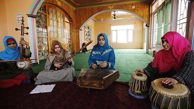 Kashmiri Muslim girls play instruments and sing Sufi music under the tutelage of music teacher, Muhammad Yaqoob Sheikh, on the outskirts of Srinagar. AFP file photo