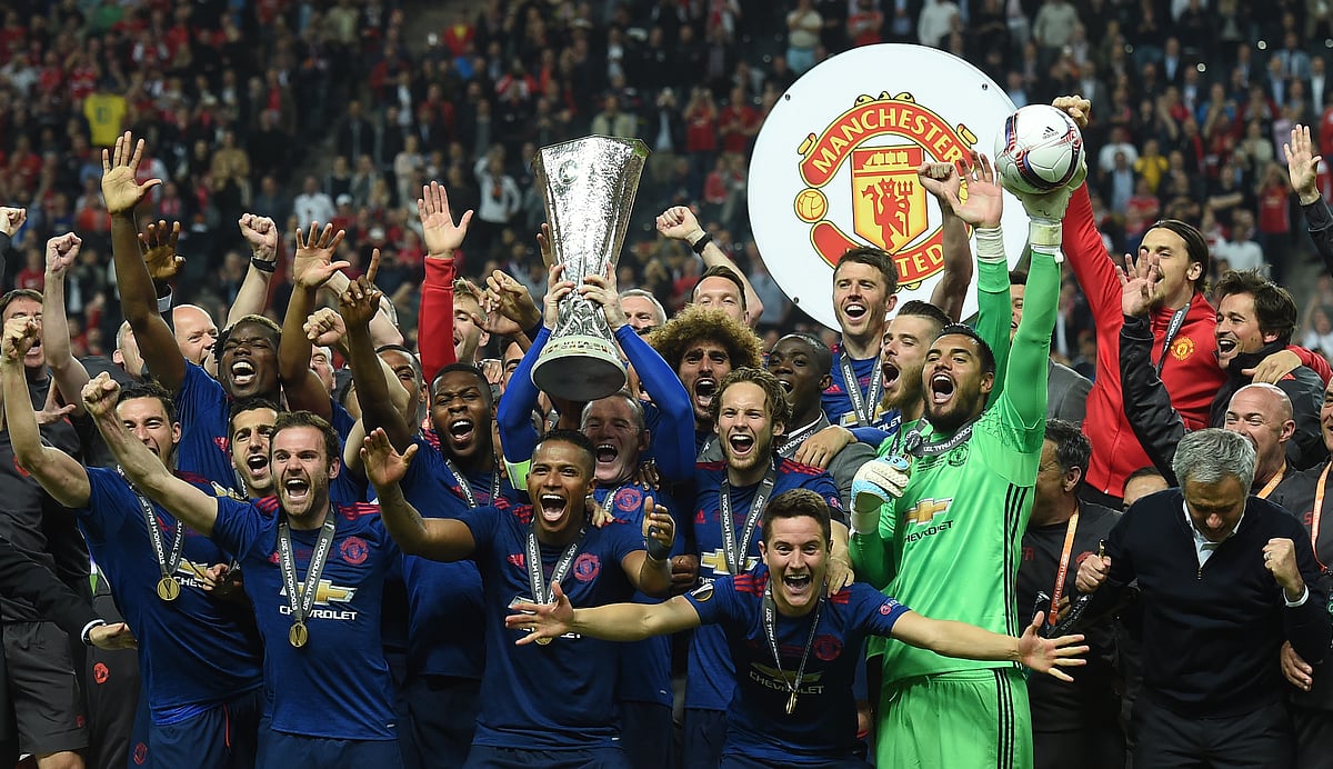 Manchester United’s players react with the trophy after the UEFA Europa League final football match Ajax Amsterdam v Manchester United. Photo: AFP