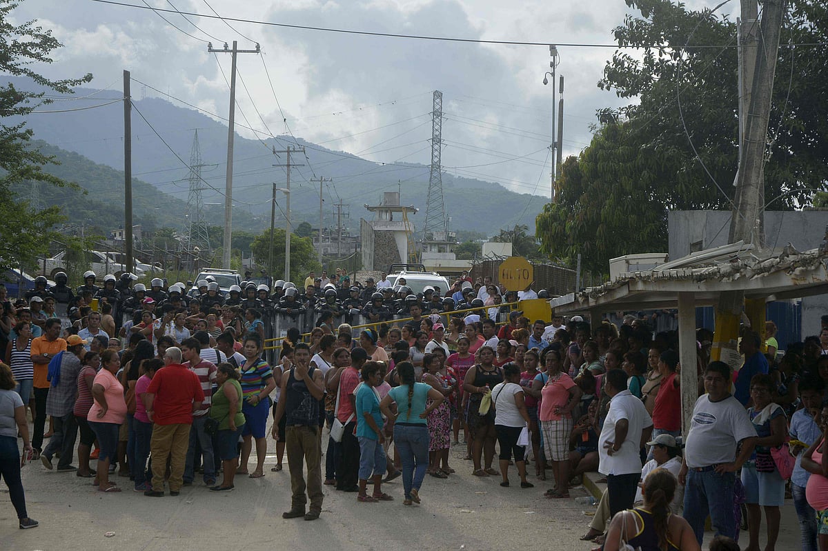 Relatives of inmates remain outside of Las Cruces prison in Acapulco, Guerrero state following a riot between prisoners which left 28 dead and three wounded, on July 6, 2017. AFP