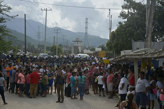 Relatives of inmates remain outside of Las Cruces prison in Acapulco, Guerrero state following a riot between prisoners which left 28 dead and three wounded, on July 6, 2017. AFP