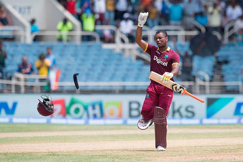 West Indies` Evin Lewis celebrates scoring a century during the T20 match between West Indies and India at the Sabina Park Cricket Ground in Kingston, Jamaica, on July 9, 2017. AFP