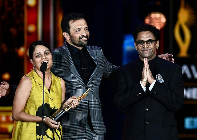 Neerja Best Picture Neerja`s director Ram Madhvani (R) and staff thank the audience on stage during the IIFA Awards 15 July, 2017 at the MetLife Stadium in East Rutherford, New Jersey during the 18th International Indian Film Academy (IIFA) Festival. Photo: AFP