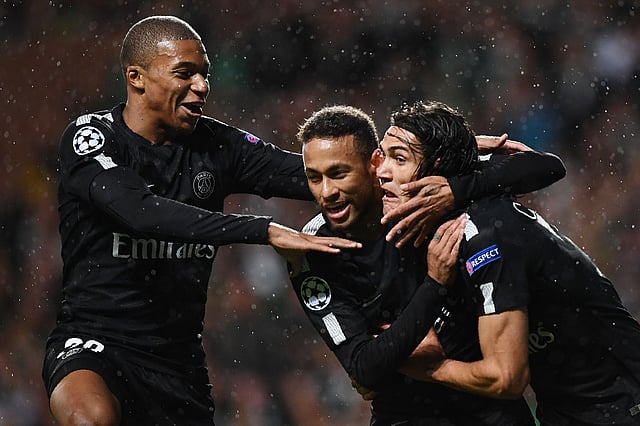 Paris Saint-Germain’s Brazilian striker Neymar © celebrates with Paris Saint-Germain’s French striker Kylian Mbappe (L) and Paris Saint-Germain’s Uruguayan striker Edinson Cavani ® after scoring the opening goal of the UEFA Champions League Group B football match between Celtic and Paris Saint-Germain (PSG) at Celtic Park in Glasgow. Photo: AFP