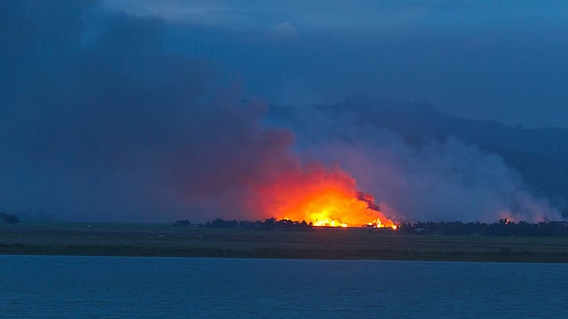 Rohingya dwellings being burnt to the ground in Myanmar. Picture taken on Wednesday evening from Naitang Para in Teknaf. Photo: Abdus Salam