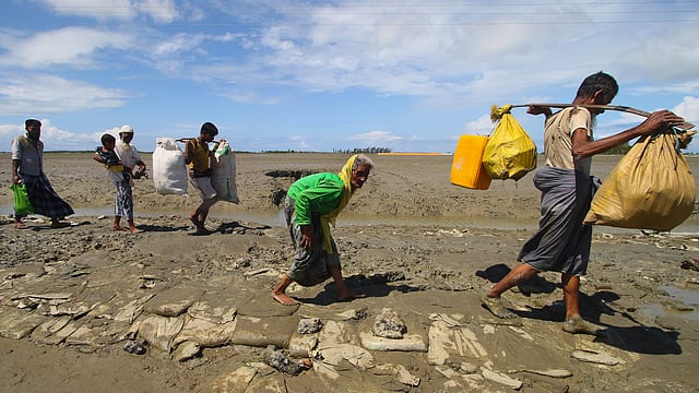 Rohingyas cross Hariakhali going towards Teknaf town. Picture taken Thursday. Photo: Abdus Salam