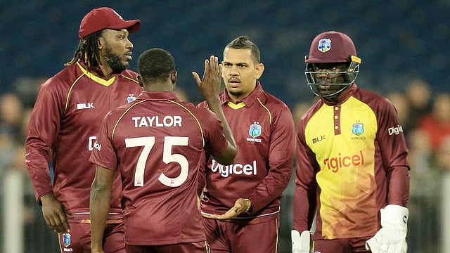 West Indies’ Sunil Narine © celebrates taking the wicket of England’s David Willey during the T20 International cricket match between England and West Indies at The Emirates Riverside, Chester-le-Street in north east England. Photo: AFP