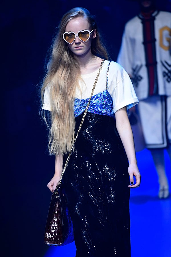 A model presents a creation for fashion house Gucci during the Men and Women`s Spring/Summer 2018 fashion shows in Milan, on September 20, 2017. AFP