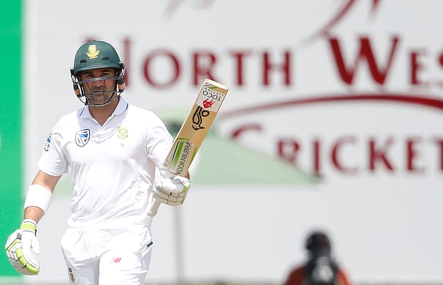 South African batsman Dean Elgar raises his bat as he celebrates scoring half century (50 Runs) during the first day of the first Test Match between South Africa and Bangladesh on 28 September, 2017 in Potchefstroom, South Africa. Photo: AFP