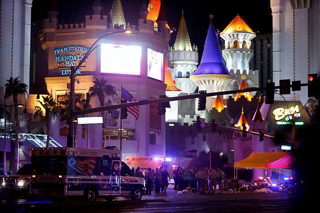 Las Vegas Metro Police and medical workers stage in the intersection of Tropicana Avenue and Las Vegas Boulevard South after a mass shooting at a music festival on the Las Vegas Strip in Las Vegas. Reuters