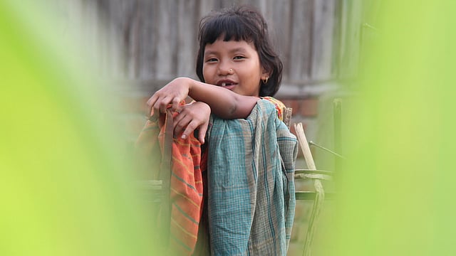 A child smiles innocently at the camera in Chelachhara of Khagrachhari sadar. Photo: Nirob Chowdhury