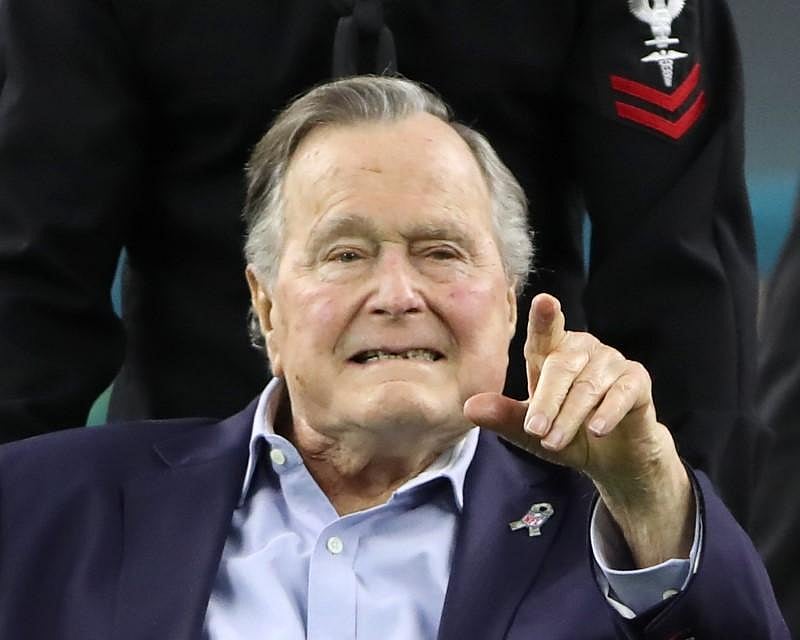 Former US President George HW Bush arrives on the field to do the coin toss ahead of the start of Super Bowl LI between the New England Patriots and the Atlanta Falcons in Houston, Texas, US. Reuters file photo