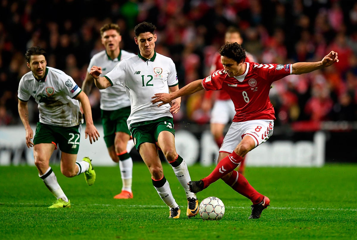 Callum O`Dowda (C) of Ireland vies against Thomas Delaney (R) of Denmark during their FIFA World Cup 2018 play-off at the Telia Parken stadium in Copenhagen on Saturday. AFP